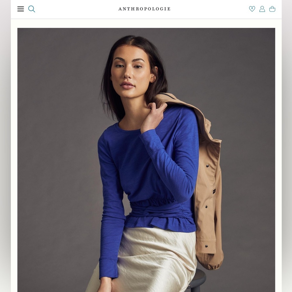 Anthropologie (Pilcro) long sleeved tshirt with front peplum and twist detail